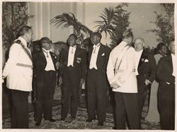 Secretary of State J. Rudolph Grimes, Ambassador Joseph E. Knight,  Charles D. Sherman, and Mrs. Grimes with Spanish officials at a reception during Tubman's state visit to Spain