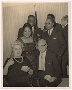Former Haitian President Paul Magloir, Madame Magloire, Consul General David Thomas with others at a reception in New York during the 1960s