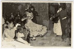 Musicians and flamenco dancers perform at a dinner