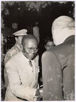 President William V. S. Tubman shakes hands with a dignitary