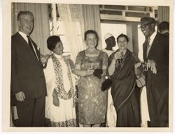 Ambassador C. T. O. King and others sharing drinks at reception