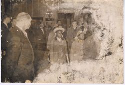 Girls in dress attire entering building