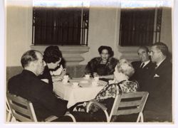 Dignitaries sit at a table