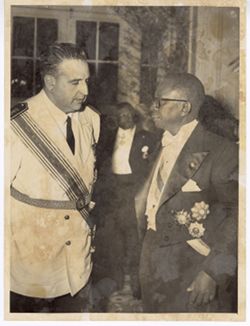 President Tubman speaking with Spanish military official