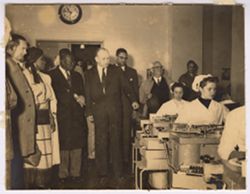 President Tubman and party watching workers during tour