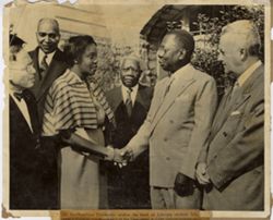 President William V. S. Tubman greets Northwestern Liberian student, Iris White Roberts with University President and others nearby