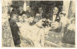 President William V. S. Tubman and Mrs. Tubman sit with guests at a formal dinner party
