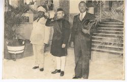 Three dignitaries in front of the Executive Mansion