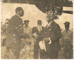 President William V. S. Tubman shakes hands with Secretary of State Grimes