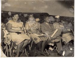 Dignitaries sit in an audience