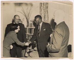 President Tubman shakes a dignitary's hand at a reception