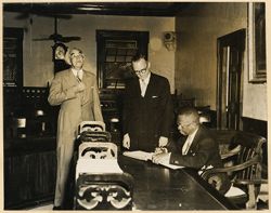 President William V. S. Tubman signs book during visit to parish of St. Catherine, Clarendon and May Pen