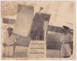 Dignitary waves from doorway of plane