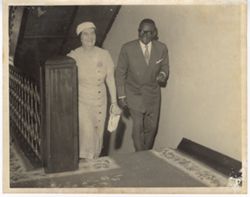 Liberian President William V. S. Tubman and Israeli Foreign Minister Golda Meir ascend stairs