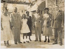 President William V. S. Tubman, two men, three woman and one child pose for portrait