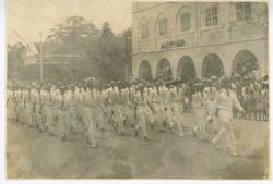 Group in uniforms march in parade