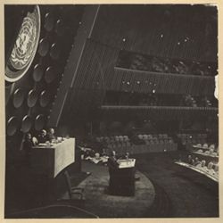 Seated at Presidental rostrum