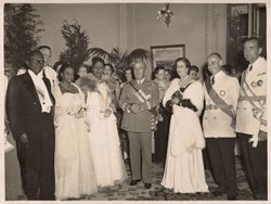 President Tubman poses for group portrait with General Franco and men and women in formal attire