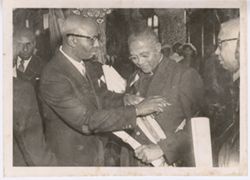Official receiving the Humane Order of African Redemption during a formal ceremony