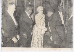 President William V. S. Tubman stands with guest as she greets official at a formal event