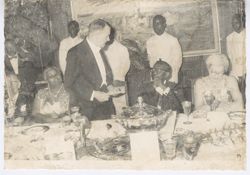 President William V. S. Tubman listens to dignitary as he speaks during dinner party