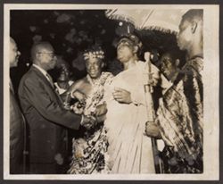 President Tubman shakes hands with a dignitary