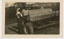 Mrs. Antoinette Tubman examine farm equipment