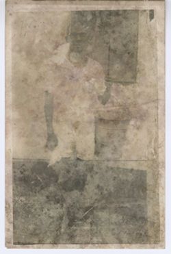 Young man in shorts poses for portrait