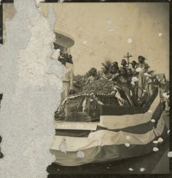 Women on float during a military parade outside of Executive Pavilion