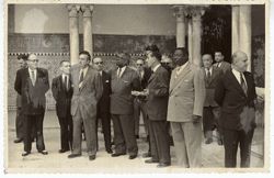 President Tubman and other dignitaries stand on a patio in Seville, Spain