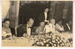 Portrait of guests eating at formal dinner