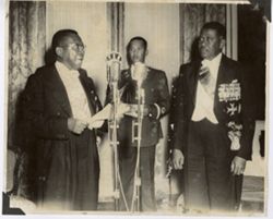 President William V. S. Tubman speaks at formal event into VRH microphone
