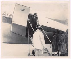 Togolese President Grunitzky decends stairs from an airplane