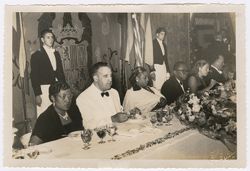 President and Mrs. Tubman seated at dinner with other guests