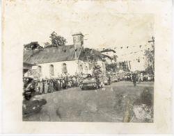 Cars drives down street during a parade