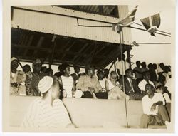 Ambassador C. T. O. King and other dignitaries in the stands during football match