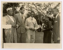 Mrs. Tubman and four others stand and laugh together at reception