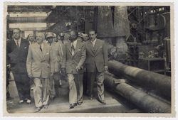 President Tubman escorted around a heavy industrial facility