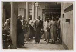 President and Mrs. Tubman in an interior pation in Spain, surrounded by clergymen, nuns and dignitaries