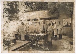 Chefs at work in kitchen during tour of a baked goods factory