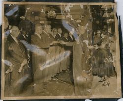 President Tubman and Attorney General Cassell hold a book as a part of a ceremony