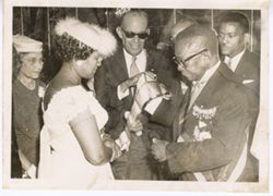 President William V. S. Tubman honors woman with a sash