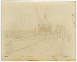 Workers around a crane