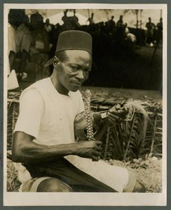 Man plays traditional instrument during reception