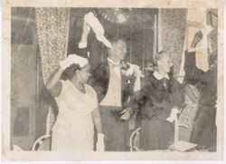 Guests wave handkerchiefs during celebration at a formal reception