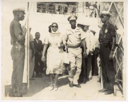 Man in military dress walks with Mrs. Tubman