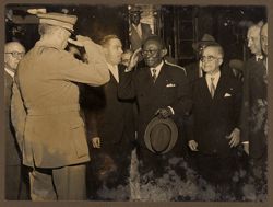 President Tubman returning a salute from military official