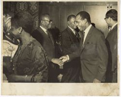President William V. S. Tubman shakes hands with man in receiving line