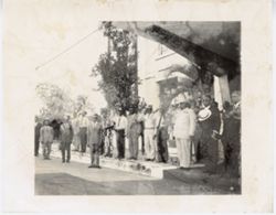 President William V. S. Tubman stands with diginitaries and officials outside of the Executive Mansion