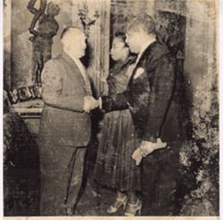 Charge d'affairs of Germany shaking hands with man